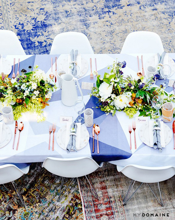 Hollywood Hills outdoor dinner party thrown by fashion designer Rachel Pally using Huddleson Diamond grey linen tablecloth, fresh meadow flowers and rose gold flatware by Kate Spade