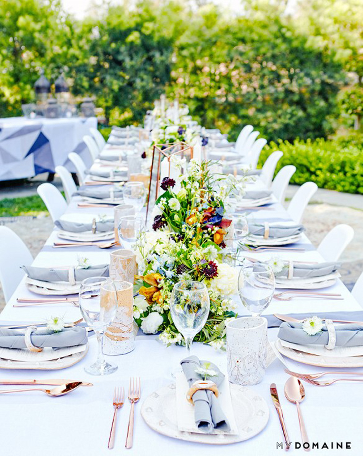 Fashion designer Rachel Pally throws outdoor dinner party in Hollywood Hills with casual modern table design of light greys, mixed metals and meadow flowers